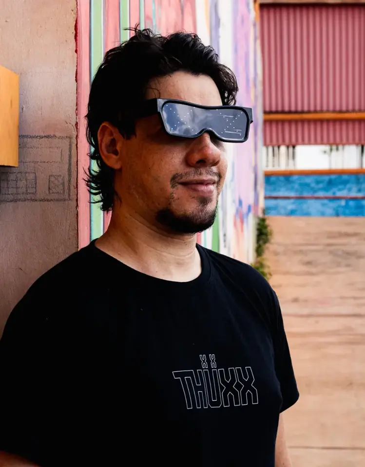Portrait of THUXX in LED glasses